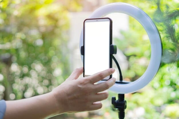 A person holding a smartphone, recording a short video with a clean and well-lit background. The screen shows editing options and visual effects.