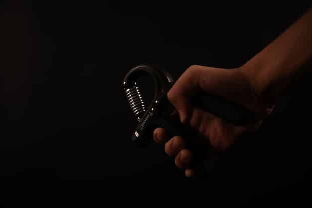 A close-up of a celebrity's hands trembling slightly as they hold a microphone on stage. The lighting is stark, emphasizing the vulnerability of the moment.