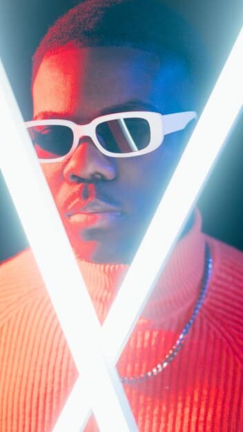 A split image showing side-by-side photos of Kanye West and Wiz Khalifa, with Twitter logos overlaid, illustrating their infamous Twitter feud. The image highlights their expressions and the tension between them.